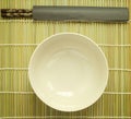 Chopsticks on bamboo matting background Royalty Free Stock Photo