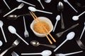 Chopsticks in bowl with noodles on black background Royalty Free Stock Photo