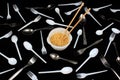 Chopsticks in bowl with noodles on black background Royalty Free Stock Photo