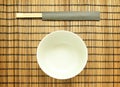 Chopsticks on brown bamboo matting background Royalty Free Stock Photo