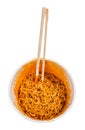 chopsticks in cooked spicy instant noodles