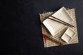 Chopsticks and empty sushi plate on bamboo mat. Black background. Royalty Free Stock Photo