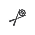 Chopsticks holding sushi roll vector icon