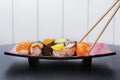 Chopsticks holding a tasty sushi