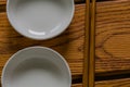 Chopsticks next to two small white dishes Royalty Free Stock Photo