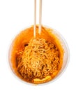 chopsticks in prepared spicy instant noodles Royalty Free Stock Photo