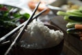 Chopsticks, rice and vegetables for cooking sushi top view. Asian cuisine Royalty Free Stock Photo