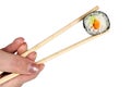 Chopsticks with salmon maki sushi Royalty Free Stock Photo