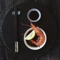 Chopsticks, shrimp and sauce, selective focus