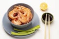 Chopsticks and soy sauce in bowl. Shrimps in gray bowl and celery stalks on plate Royalty Free Stock Photo