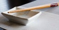 Chopsticks sushi with cup Royalty Free Stock Photo