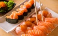 Chopsticks and Sushi salmon on dish in restaurant,Japanese style Royalty Free Stock Photo