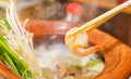 Chopsticks and tongs of hot prawns put up to eat Shabu Hot Pot. Prepare eating food Royalty Free Stock Photo