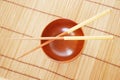 Chopsticks with wooden bowl Royalty Free Stock Photo