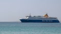 CHORA, MYKONOS, GREECE- SEPTEMBER,15, 2016: medium view as a blue star ferry arrives at the island of mykonos Royalty Free Stock Photo