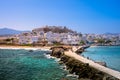 Chora of Naxos island as seen from the famous landmark the Portara with the natural stone walkway towards the village, Cyclades.