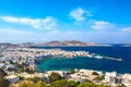 Chora port of Mykonos island with red church, famous windmills, ships and yachts during summer sunny day. Aegean sea, Greece Royalty Free Stock Photo