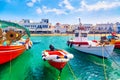 Chora port of Mykonos island with ships, yachts and boats during summer sunny day. Aegean sea, Greece Royalty Free Stock Photo