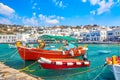 Chora port of Mykonos island with ships, yachts and boats during summer sunny day. Aegean sea, Greece Royalty Free Stock Photo