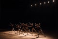 A choreographed dance of a group of graceful pretty young ballerinas practicing on stage in a classical ballet school. Royalty Free Stock Photo