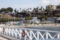 Chorillos Peru--Artisanal fishing port with wooden pier and railing the Pacific Ocean, in the background modern buildings Royalty Free Stock Photo