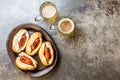 Choripan. Latin American Argentine and chilean food. Grilled chorizo sausages hot dogs served with beer, top view, stone Royalty Free Stock Photo