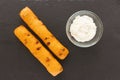 Chorizo breadstick and garlic cheese dipping sauce on black background Royalty Free Stock Photo