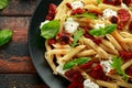 Chorizo, Penne pasta with creamy ricotta cheese and greens Royalty Free Stock Photo