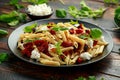 Chorizo, Penne pasta with creamy ricotta cheese and greens Royalty Free Stock Photo