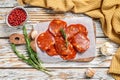 Chorizo sausage thin cut on a cutting board. Spanish salami with spices, paprika, pepper. Spicy food. White background. Top view Royalty Free Stock Photo