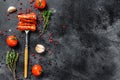 Chorizo sausage thin cut. Spanish salami with spices, paprika, pepper. Spicy food. Black background. Top view. Copy space Royalty Free Stock Photo