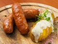 Chorizo sausages with potatoes baked under cheese Royalty Free Stock Photo