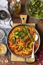 Chorizo and yellow split peas stew with tomatoes and padrones peppers
