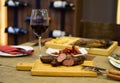 Chorizos with a glass of wine in an elegant setting