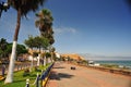 Chorrillos Peru- mall with streets palm trees and pedestrian sidewalk with buildings and ocean background without people -