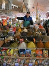 Spices vendor behind his stall in Chorsu bazaar in Tashkent, Uzbekistan