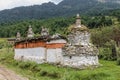 Chorten made of red and white colored stones in a garden in Bumthang, Bhutan Royalty Free Stock Photo