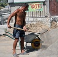 A worker loaded a mixture of a wheelbarrow