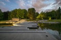 Chorzow, Poland - July 03, 2023: Japanese garden in the Silesian park in the evening. Illuminated lighting of the water cascade