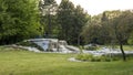 Chorzow, Poland - June 20, 2023: .Japanese garden in the Silesian park. A granite cascade with a waterfall and a viewpoint