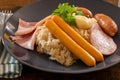 Choucroute garnie French for dressed sauerkraut is an Alsatian recipe for preparing sauerkraut with sausages and other Royalty Free Stock Photo