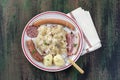 Choucroute garnie, a typical alsacian plate, with sausages, bacon, sauerkraut and potatoes on wooden background Royalty Free Stock Photo