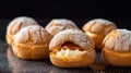 Choux au Craquelin: A display of choux pastry puffs, sugar-coated shells encasing cream filling