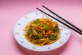 Chowmein noodles on a plate with chopsticks