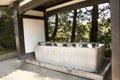 Chozusha or Holy water in wash hand stone basin for people washing before go to inside japanese temple or Mitarashi ritual