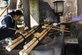 Chozusha or Holy water in wash hand stone basin for people washing before go to inside japanese temple or Mitarashi ritual