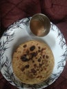 Chpati with tee on the a white plate it`s like Indian morning food