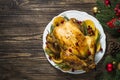 Chrismas chicken baked with cranberry, orange and rosemary. Christmas dinner. Royalty Free Stock Photo