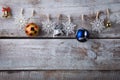 Chrismas decorations hanging on rope on wooden background