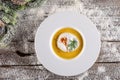 Chrismas fish soup in white plate with christmas decorations, modern gastronomy Royalty Free Stock Photo